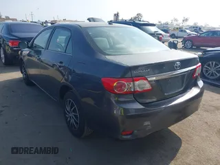 2011 Toyota Corolla L with VIN JTDBU4EE3BJ090749, listed as a IAAI auction lot 42106633 with 209,824 mi miles. Bid and sale history available at carsss.com. Image 3.