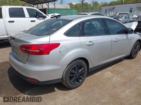 2016 Ford Focus SE with VIN 1FADP3F23GL373801, listed as a IAAI auction lot 42083360 with 52,993 mi miles and . Bid and sale history available at DreamBid. Image 4.