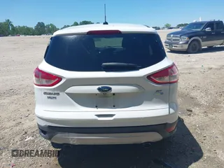 2014 Ford Escape SE with VIN 1FMCU9G90EUB76911, listed as a IAAI auction lot 42143518 with 123,466 mi miles and . Bid and sale history available at DreamBid. Image 16.