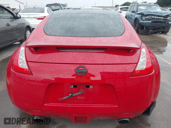 2016 Nissan 370Z z VIN JN1AZ4EHXGM932681, wystawiony jako IAAI lot #42350850 z przebiegiem 94 586 mil mil oraz . Historia ofert i sprzedaży dostępna na DreamBid. Obrazek 16.