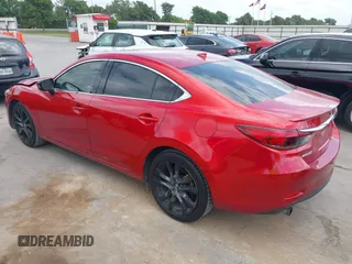 2016 Mazda 6 i Grand Touring z VIN JM1GJ1W58G1486694, wystawiony jako IAAI lot #42094443 z przebiegiem 77 803 mil mil oraz . Historia ofert i sprzedaży dostępna na DreamBid. Obrazek 3.