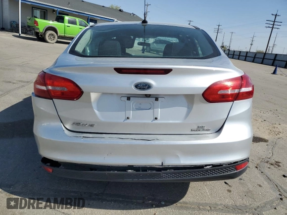 2015 Ford Focus SE with VIN 1FADP3F28FL241020, listed as a Copart auction lot 54559135 with 123,008 mi miles and Salvage title. Bid and sale history available at DreamBid. Image 6.
