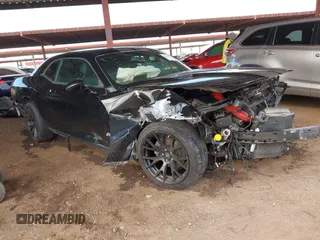 2014 Dodge Challenger SXT 100th Anniversary z VIN 2C3CDYAG3EH180108, wystawiony jako IAAI lot #41778328 z przebiegiem Nie podano mil oraz . Historia ofert i sprzedaży dostępna na DreamBid. Obrazek 1.
