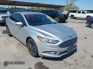 2018 Ford Fusion SE z VIN 3FA6P0HD2JR256502, wystawiony jako IAAI lot #41972769 z przebiegiem 87 854 mil mil oraz . Historia ofert i sprzedaży dostępna na DreamBid. Obrazek 1.