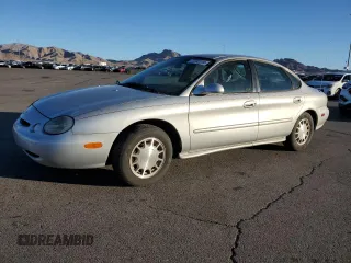 1996 Ford Taurus LX with VIN 1FALP53S9TG173438, listed as a Copart auction lot 77232114 with 89,789 mi miles and Clean title. Bid and sale history available at DreamBid. Image 1.
