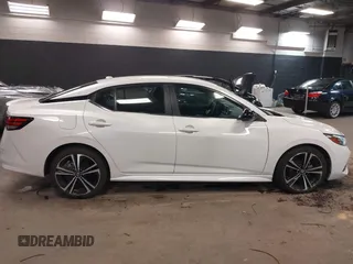 2021 Nissan Sentra SR z VIN 3N1AB8DVXMY320878, wystawiony jako IAAI lot #41911623 z przebiegiem 13 134 mil mil oraz . Historia ofert i sprzedaży dostępna na DreamBid. Obrazek 13.