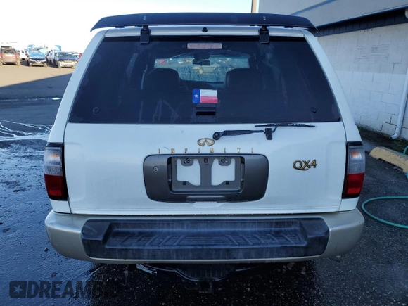 2000 Infiniti QX4 z VIN JNRAR07Y3YW084474, wystawiony jako Copart lot #87089994 z przebiegiem 237 974 mil mil oraz Szkody całkowita. Historia ofert i sprzedaży dostępna na DreamBid. Obrazek 6.