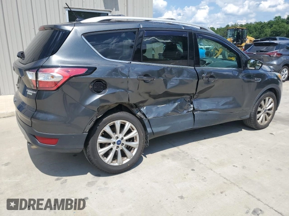 2018 Ford Escape Titanium with VIN 1FMCU0J93JUB20136, listed as a Copart auction lot 56841065 with 129,954 mi miles and Salvage title. Bid and sale history available at DreamBid. Image 3.