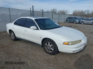 1999 Oldsmobile Intrigue GL z VIN 1G3WS52H6XF369523, wystawiony jako IAAI lot #41732566 z przebiegiem 153 883 mil mil oraz . Historia ofert i sprzedaży dostępna na DreamBid. Obrazek 1.