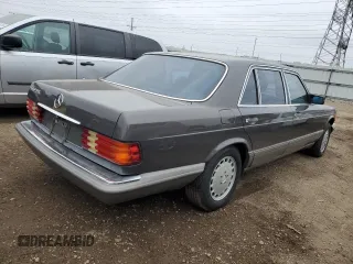1987 Mercedes-Benz 560 with VIN WDBCA39D7HA322057, listed as a Copart auction lot 83717904 with 246,060 mi miles and Clean Title. Bid and sale history available at DreamBid. Image 3.