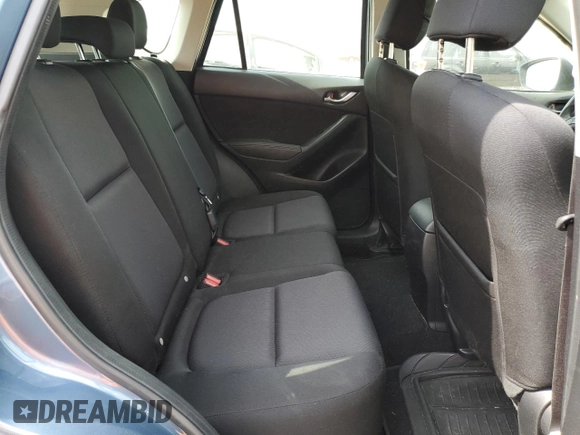2015 Mazda CX-5 Sport z VIN JM3KE2BE8F0434116, wystawiony jako Copart lot #60712625 z przebiegiem 300 405 mil mil oraz Szkoda całkowita • Salvage title. Historia ofert i sprzedaży dostępna na DreamBid. Obrazek 11.