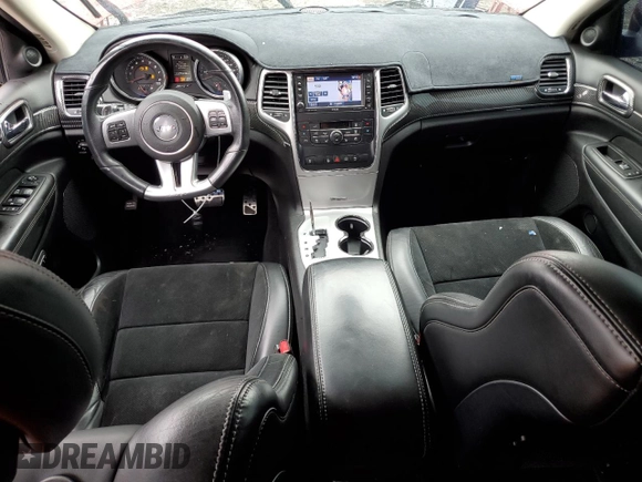 2012 Jeep Grand Cherokee SRT8 with VIN 1C4RJFDJ0CC351195, listed as a Copart auction lot 72794454 with 104,672 mi miles and Salvage Title. Bid and sale history available at carsss.com. Image 8.