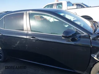 2018 Toyota Camry LE z VIN 4T1B11HK4JU151656, wystawiony jako IAAI lot #41524694 z przebiegiem 52 581 mil mil oraz . Historia ofert i sprzedaży dostępna na DreamBid. Obrazek 13.
