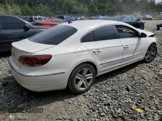 2014 Volkswagen CC Sport with VIN WVWBN7AN3EE528302, listed as a Copart auction lot 69636034 with 77,332 mi miles and Salvage Title. Bid and sale history available at DreamBid. Image 3.