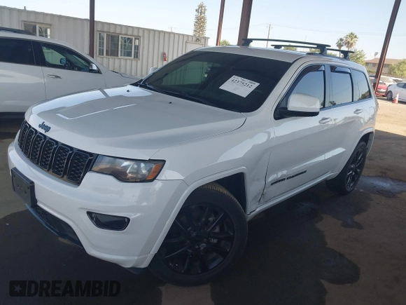 2018 Jeep Grand Cherokee Laredo E with VIN 1C4RJFAG5JC303228, listed as a IAAI auction lot 42375212 with 98,155 mi miles and . Bid and sale history available at DreamBid. Image 2.