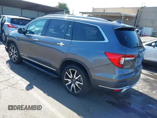 2021 Honda Pilot Touring 8-Passenger with VIN 5FNYF6H97MB034399, listed as a IAAI auction lot 42303419 with 50,034 mi miles and . Bid and sale history available at DreamBid. Image 3.