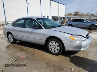 2003 Ford Taurus LX Standard z VIN 1FAFP52U93A159333, wystawiony jako Copart lot #78080944 z przebiegiem 54 652 mil mil oraz Szkoda całkowita • Salvage title. Historia ofert i sprzedaży dostępna na DreamBid. Obrazek 4.