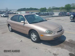 1997 Ford Taurus GL z VIN 1FALP52U5VA288787, wystawiony jako IAAI lot #42468898 z przebiegiem 124 214 mil mil oraz . Historia ofert i sprzedaży dostępna na DreamBid. Obrazek 1.