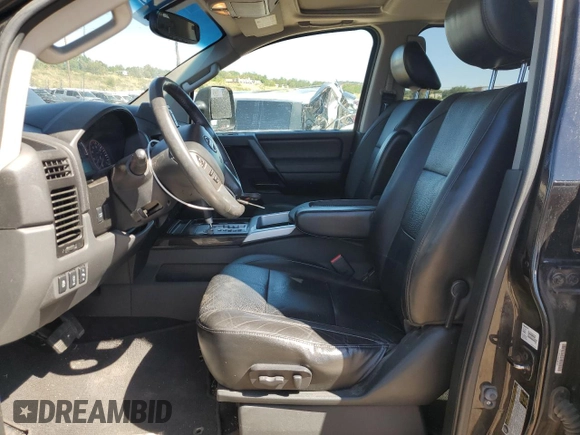 2014 Nissan Titan Pro-4X with VIN 1N6AA0EC2EN519983, listed as a Copart auction lot 71496934 with 150,259 mi miles and Salvage title. Bid and sale history available at DreamBid. Image 7.