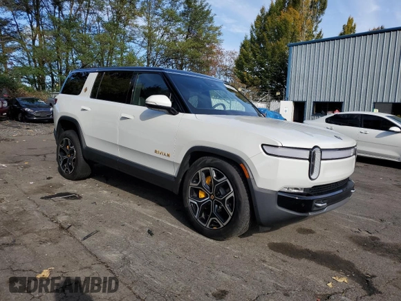 2024 Rivian R1S Adventure z VIN 7PDSGABAXRN035766, wystawiony jako Copart lot #77481034 z przebiegiem 6 590 mil mil oraz Szkoda całkowita • Salvage title. Historia ofert i sprzedaży dostępna na DreamBid. Obrazek 4.