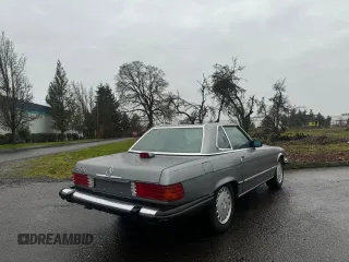 1987 Mercedes-Benz 560 SL with VIN WDBBA48D4HA059822, listed as a Copart auction lot 85827514 with 128,288 mi miles and Clean Title. Bid and sale history available at carsss.com. Image 4.
