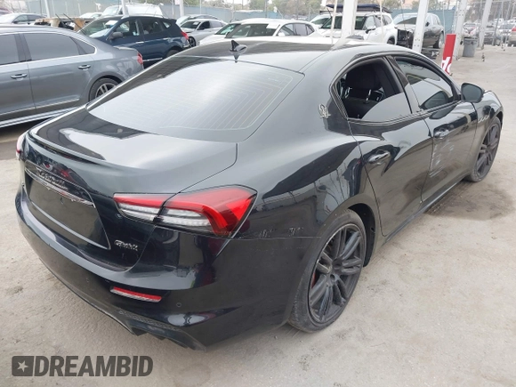 2021 Maserati Ghibli S with VIN ZAM57YSA3M1365483, listed as a IAAI auction lot 42562390 with 51,954 mi miles and . Bid and sale history available at DreamBid. Image 4.