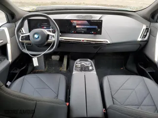 2023 BMW iX xDrive50 with VIN WB523CF09PCL96538, listed as a Copart auction lot 44728454 with 33,929 mi miles. Bid and sale history available at carsss.com. Image 8.