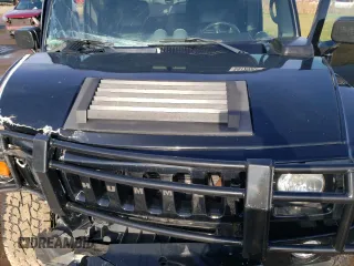 2005 Hummer H2 SUV with VIN 5GRGN23U35H111403, listed as a Copart auction lot 84720994 with 142,159 mi miles and Salvage Title. Bid and sale history available at carsss.com. Image 12.