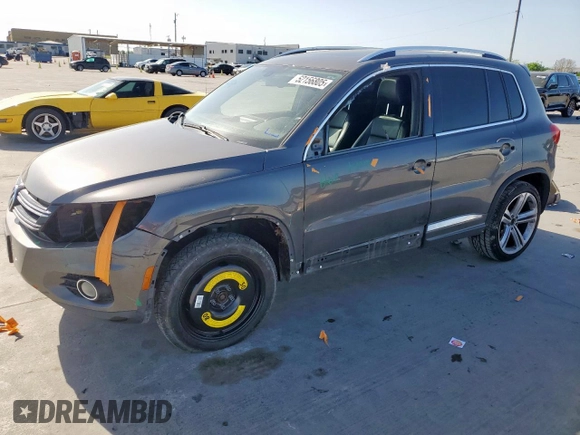 2014 Volkswagen Tiguan SEL z VIN WVGAV3AX6EW030705, wystawiony jako Copart lot #52156805 z przebiegiem 142 377 mil mil oraz Szkoda całkowita • Salvage title. Historia ofert i sprzedaży dostępna na DreamBid. Obrazek 1.