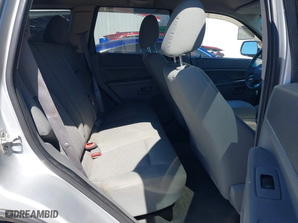 2007 Jeep Grand Cherokee Laredo with VIN 1J8HR48P87C687411, listed as a IAAI auction lot 41774029 with 212,763 mi miles. Bid and sale history available at carsss.com. Image 8.