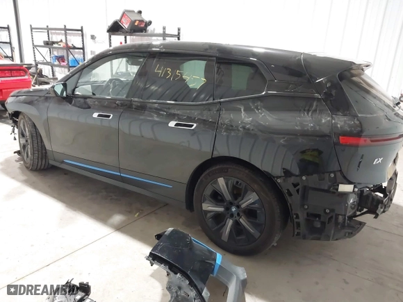2023 BMW iX xDrive50 with VIN WB523CF04PCL15607, listed as a IAAI auction lot 41315457 with 44,058 mi miles. Bid and sale history available at carsss.com. Image 3.