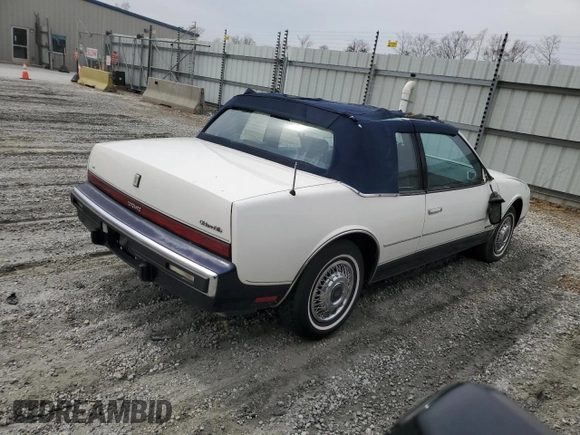 1987 Oldsmobile Toronado with VIN 1G3EZ1130HU307201, listed as a Copart auction lot 49290815 with 104,837 mi miles and Salvage Title. Bid and sale history available at DreamBid. Image 3.