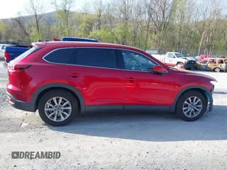 2019 Mazda CX-9 Touring with VIN JM3TCACY0K0310851, listed as a IAAI auction lot 42066395 with 91,046 mi miles and . Bid and sale history available at DreamBid. Image 14.