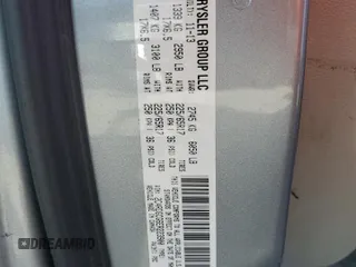 2014 Dodge Grand Caravan SXT z VIN 2C4RDGCG6ER223900, wystawiony jako Copart lot #56960965 z przebiegiem 101 275 mil mil oraz Szkoda całkowita • Salvage title. Historia ofert i sprzedaży dostępna na DreamBid. Obrazek 13.