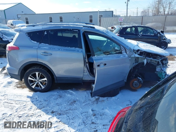 2018 Toyota RAV4 XLE with VIN 2T3RFREV8JW753853, listed as a IAAI auction lot 41526071 with 104,642 mi miles. Bid and sale history available at carsss.com. Image 14.
