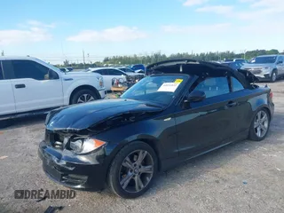 2011 BMW 1 Series 128i with VIN WBAUL7C54BVM80474, listed as a IAAI auction lot 42031032 with 76,617 mi miles and . Bid and sale history available at carsss.com. Image 17.
