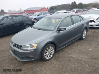 2014 Volkswagen Jetta Sedan SE w/Connectivity with VIN 3VWD17AJ2EM217534, listed as a IAAI auction lot 41872938 with 99,764 mi miles. Bid and sale history available at carsss.com. Image 2.