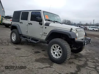 2007 Jeep Wrangler Unlimited X with VIN 1J4GA39177L105582, listed as a Copart auction lot 88912935 with 156,156 mi miles and Salvage Title. Bid and sale history available at DreamBid. Image 4.