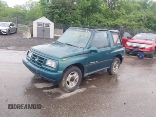 1996 Chevrolet Tracker z VIN 2CNBJ1860T6910906, wystawiony jako IAAI lot #42257309 z przebiegiem 206 888 mil mil oraz . Historia ofert i sprzedaży dostępna na DreamBid. Obrazek 2.