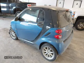 2009 Smart fortwo Pure with VIN WMEEJ31X89K228315, listed as a IAAI auction lot 42662931 with 60,666 mi miles and . Bid and sale history available at DreamBid. Image 3.