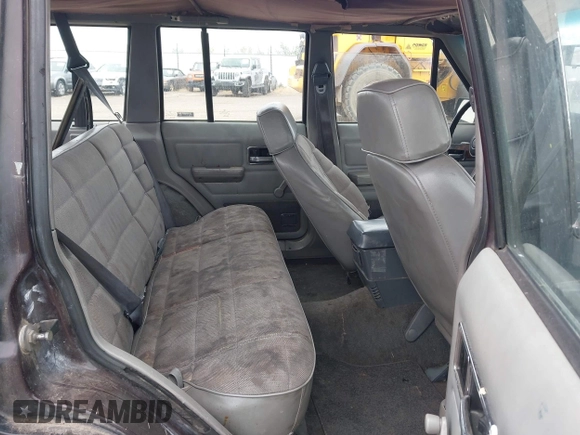 1991 Jeep Cherokee with VIN 1J4FJ88S0ML527479, listed as a IAAI auction lot 42189457 with 321,419 mi miles and . Bid and sale history available at DreamBid. Image 8.