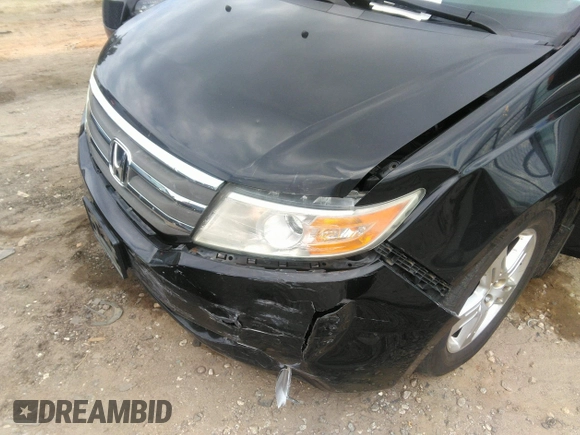 2012 Honda Odyssey Touring with VIN 5FNRL5H97CB066596, listed as a IAAI auction lot 42472935 with 217,182 mi miles and . Bid and sale history available at DreamBid. Image 6.