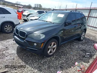 2008 BMW X5 3.0si with VIN 5UXFE43548L009495, listed as a IAAI auction lot 41694127 with 165,173 mi miles. Bid and sale history available at carsss.com. Image 2.