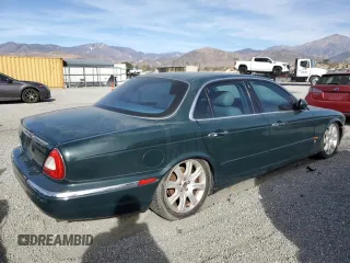 2004 Jaguar XJ with VIN SAJWA71C34SG29498, listed as a Copart auction lot 42653715 with 116,956 mi miles and Salvage Title. Bid and sale history available at carsss.com. Image 3.