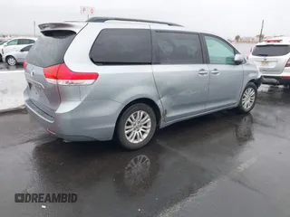 2011 Toyota Sienna XLE AAS with VIN 5TDYK3DC5BS111467, listed as a IAAI auction lot 41560895 with 126,917 mi miles. Bid and sale history available at carsss.com. Image 4.