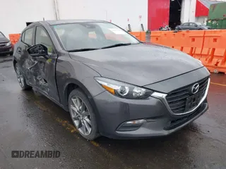 2018 Mazda 3 Touring z VIN 3MZBN1L33JM204700, wystawiony jako IAAI lot #41857344 z przebiegiem 52 873 mil mil oraz . Historia ofert i sprzedaży dostępna na DreamBid. Obrazek 1.
