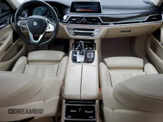 2016 BMW 7 Series 750i with VIN WBA7F0C54GGL99661, listed as a Copart auction lot 71742154 with 104,498 mi miles and Salvage Title. Bid and sale history available at carsss.com. Image 8.