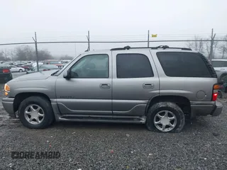 2005 GMC Yukon Denali z VIN 1GKEK63U25J228296, wystawiony jako IAAI lot #40980307 z przebiegiem 192 353 mil mil oraz . Historia ofert i sprzedaży dostępna na DreamBid. Obrazek 14.