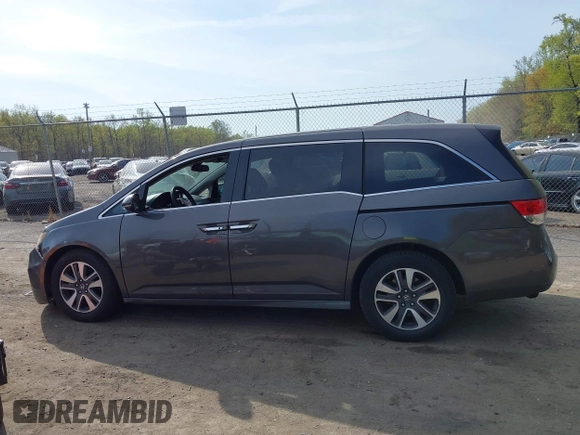 2014 Honda Odyssey Touring with VIN 5FNRL5H92EB073085, listed as a IAAI auction lot 42065913 with 120,834 mi miles and . Bid and sale history available at DreamBid. Image 14.