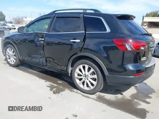 2015 Mazda CX-9 Grand Touring z VIN JM3TB2DA4F0450014, wystawiony jako IAAI lot #41692935 z przebiegiem 90 800 mil mil oraz . Historia ofert i sprzedaży dostępna na DreamBid. Obrazek 3.